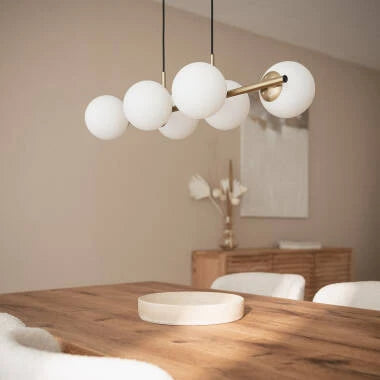 Hanglamp Doltrano in goud, sfeerbeeld in het interieur
